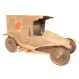 An early 20th century tinplate and clockwork model of a military ambulance finished in grey with