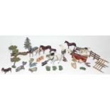 A small group of Britains lead animals and trees and to include a black smiths forge all in play