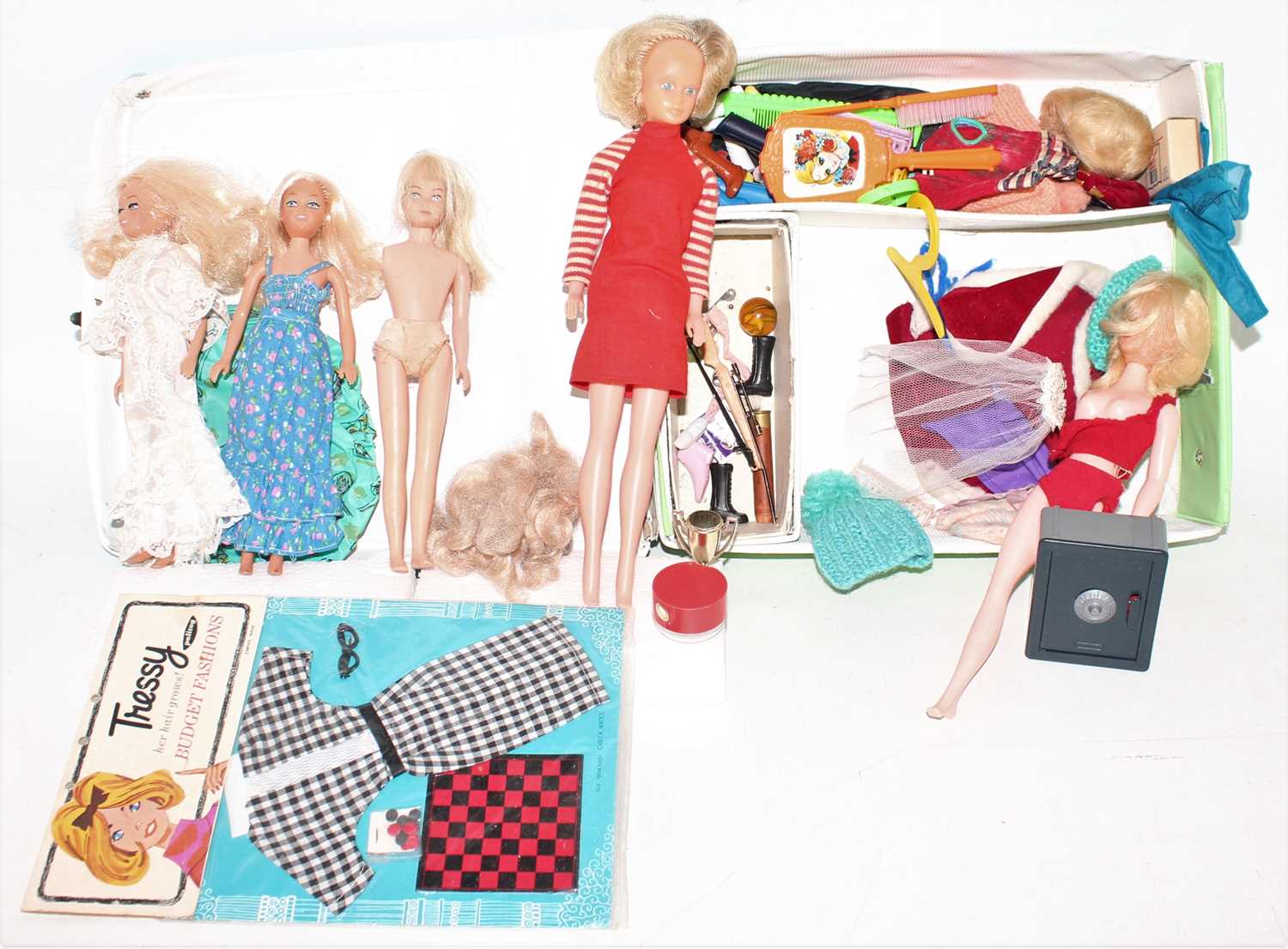 A "The World of Barbie" by Mattell doll case, containing a quantity of various Barbie dolls,