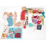 A "The World of Barbie" by Mattell doll case, containing a quantity of various Barbie dolls,