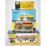 Four various boxed mixed manufacturers 1/50 scale construction vehicles to include a Norscot Grove