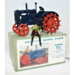 A Britains No. 127F model farm series diecast model of a Fordson Major tractor fitted with spudded