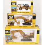 A Norscot Caterpillar 1/50 scale boxed diecast group, three examples to include a Caterpillar 545