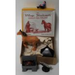 An FG Taylor & Sons Ltd model No. 169 The Village Blacksmith gift set, comprising of anvil, forge,