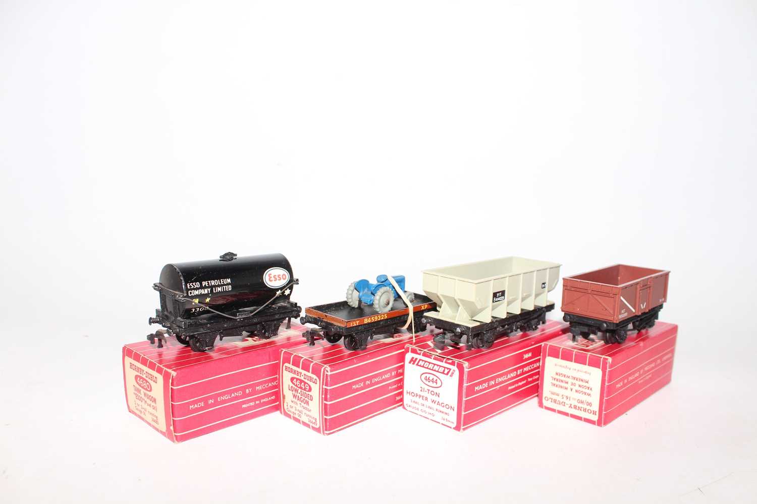 Four Hornby-Dublo goods wagons: 4644 21-ton hopper (E-BErepro); 4649 low sided with tractor (NM-BE);