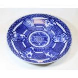 A 20th century Japanese blue & white stoneware charger, decorated with birds amongst flowers, within