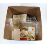 A box of miscellaneous postcards and cigarette cards, loose