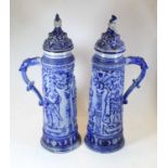 A large pair of early 20th century German Rheinland stoneware beersteins and covers, h.53cmCondition
