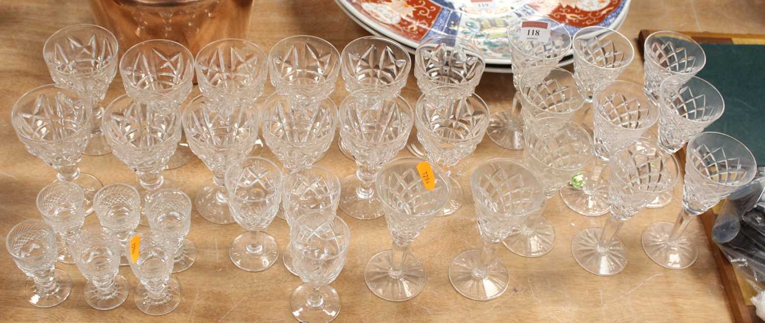 A collection of 32 cut glass drinking glasses