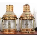 A pair of early 20th century copper and brass anchor lights, each bearing plaque inscribed 'No