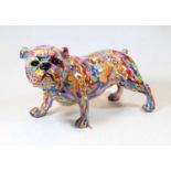 A modern composition model of a bulldog, colourfully decorated with flowers, h.20cm