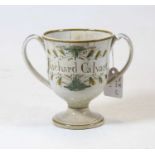 A George III pearlware loving cup for Richard Calvert dated 1793, underglaze decorated with floral