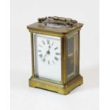 A French lacquered brass carriage clock, having visible platform escapement, early 20th century