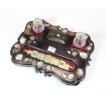A Victorian ebonised and mother of pearl inlaid desk stand with gilt painted decoration, 33cm wide