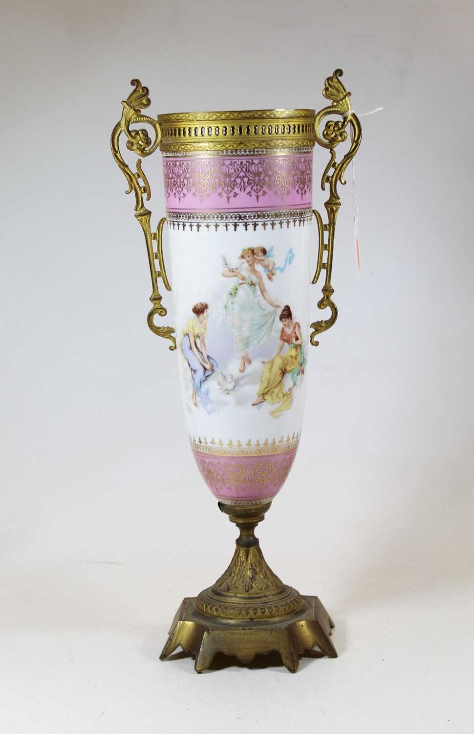 A circa 1900 Continental porcelain and gilt metal mounted urn, decorated with allegorical scenes,
