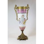 A circa 1900 Continental porcelain and gilt metal mounted urn, decorated with allegorical scenes,
