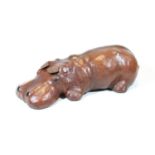 A modern brown leather clad model of a hippo, 31cm longCondition report: Both ears have been off and