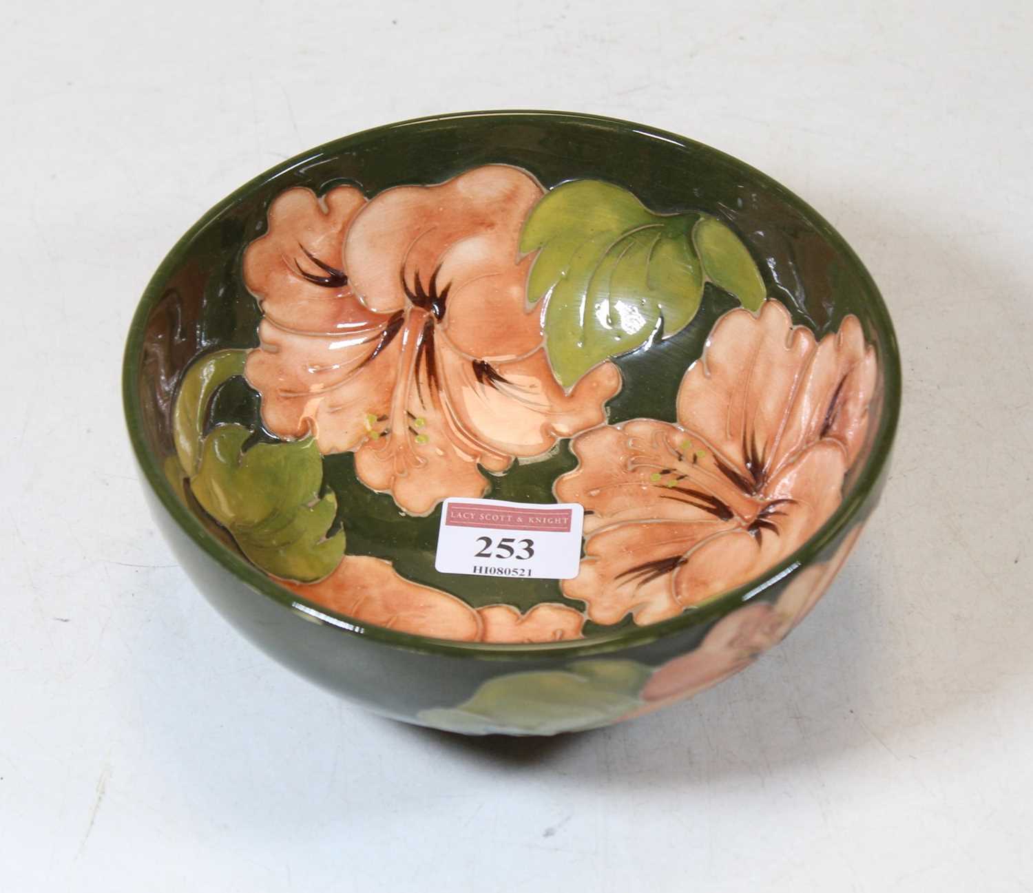 A Moorcroft footed bowl, impressed and signed with monogram verso, dia.16cm