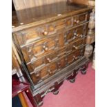 An antique geometric moulded oak chest-on-stand, the chest with four long drawers, raised on squat