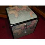 A graduated set of three trunks, each with chrome caps and fittings, printed with a map of the