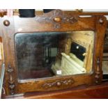 A moulded oak framed and bevelled wall mirror, 72x53cm