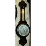 A carved oak two-dial aneroid wheel barometer, h.66cm