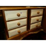 A pair of modern pine and painted three drawer bedside chests, width 45.5cm