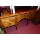 An Edwardian mahogany and chequer strung kneehole sideboard, having single central drawer flanked by