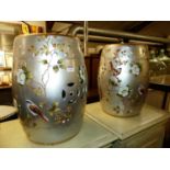 A pair of silvered and polychrome painted ceramic barrel garden seats, h.45cm