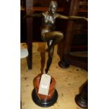After Chiparus - a bronzed metal figure of an exotic dancer, her arms outstretched and her right leg