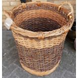 A large wicker twin handled cylindrical log basket, dia. 65cm