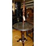 A 19th century mahogany turned pedestal lamp, with dished centre tier