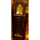 A Jacobean style oak grandmother clock, having three-train chiming movement, with pendulum, h.172cm