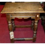 A 19th century joined oak joint stool, raised on turned supports (with past evidence of woodworm),