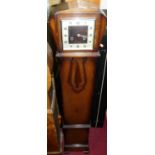 An Art Deco oak cased grand-daughter clock, h.128cmCondition report: Feather pendulum is broken,