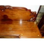 A Victorian mahogany inverted breakfront four door sideboard, the raised back with carved Prince