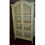 A contemporary French style white painted double door pantry cupboard, with wirework inset doors,