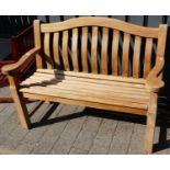 A contemporary Alexander Rose slatted teak two-seater garden bench, width 131cmCondition report: