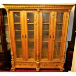 A continental pine glazed four door bookcase, having two frieze drawers, w.162cmCondition report: