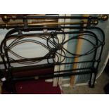 A Victorian style black painted wrought iron and brass three-quarter size bedstead, having twin iron