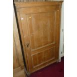 A French pine single door pantry cupboard, enclosing fixed shelved interior raised on bun feet,