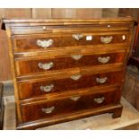 An early Georgian style figured walnut and crossbanded chest, having four long graduated drawers,