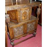 A small early 20th century floral relief carved oak court cupboard, in the 17th century taste,