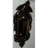 A circa 1900 continental carved fruitwood wall mirror, h.75cm