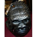 A large contemporary silvered ceramic model head of a gorilla, height 39cm