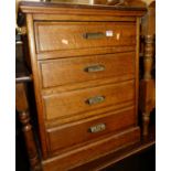 An early 20th century oak four drawer office chest, with twin panelled sides, w.57.5cm