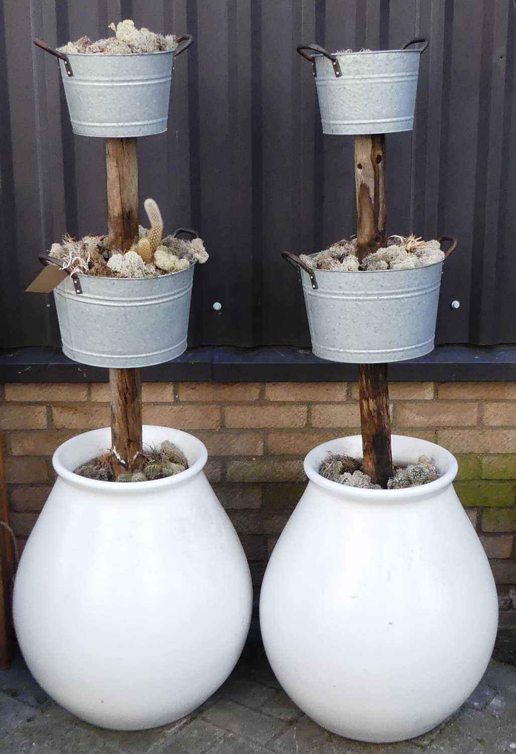 A pair of glazed stoneware, galvanised metal and wood three-tier freestanding planters, each