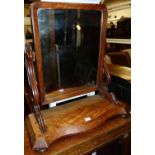 A mid-Victorian mahogany swing toilet mirror, raised on Serpentine front base