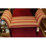 A contemporary mahogany and striped upholstered window seat, with scroll ends and raised on fluted