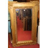 Circa 1900 gilt composition framed and bevelled wall mirror, 140x82cm